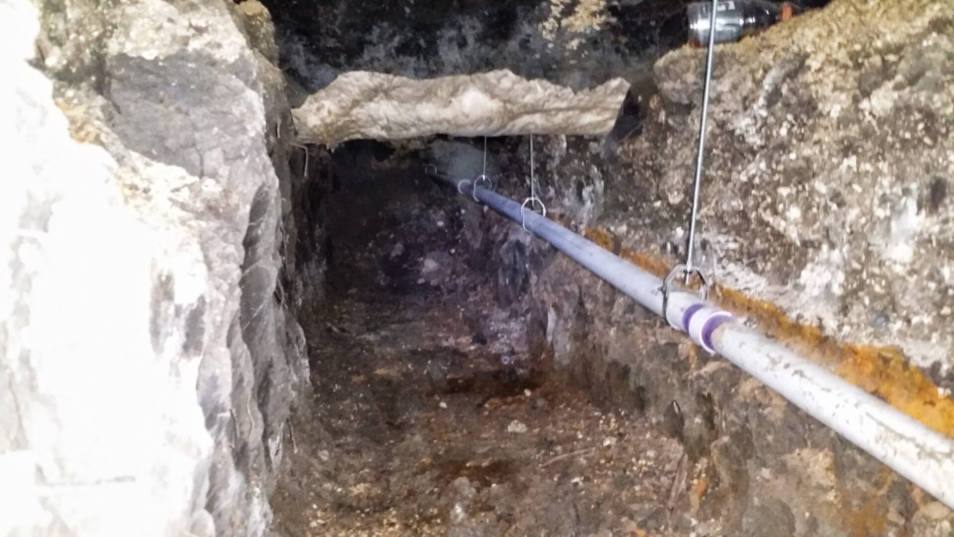 Under-slab tunnel with new drain pipes installed